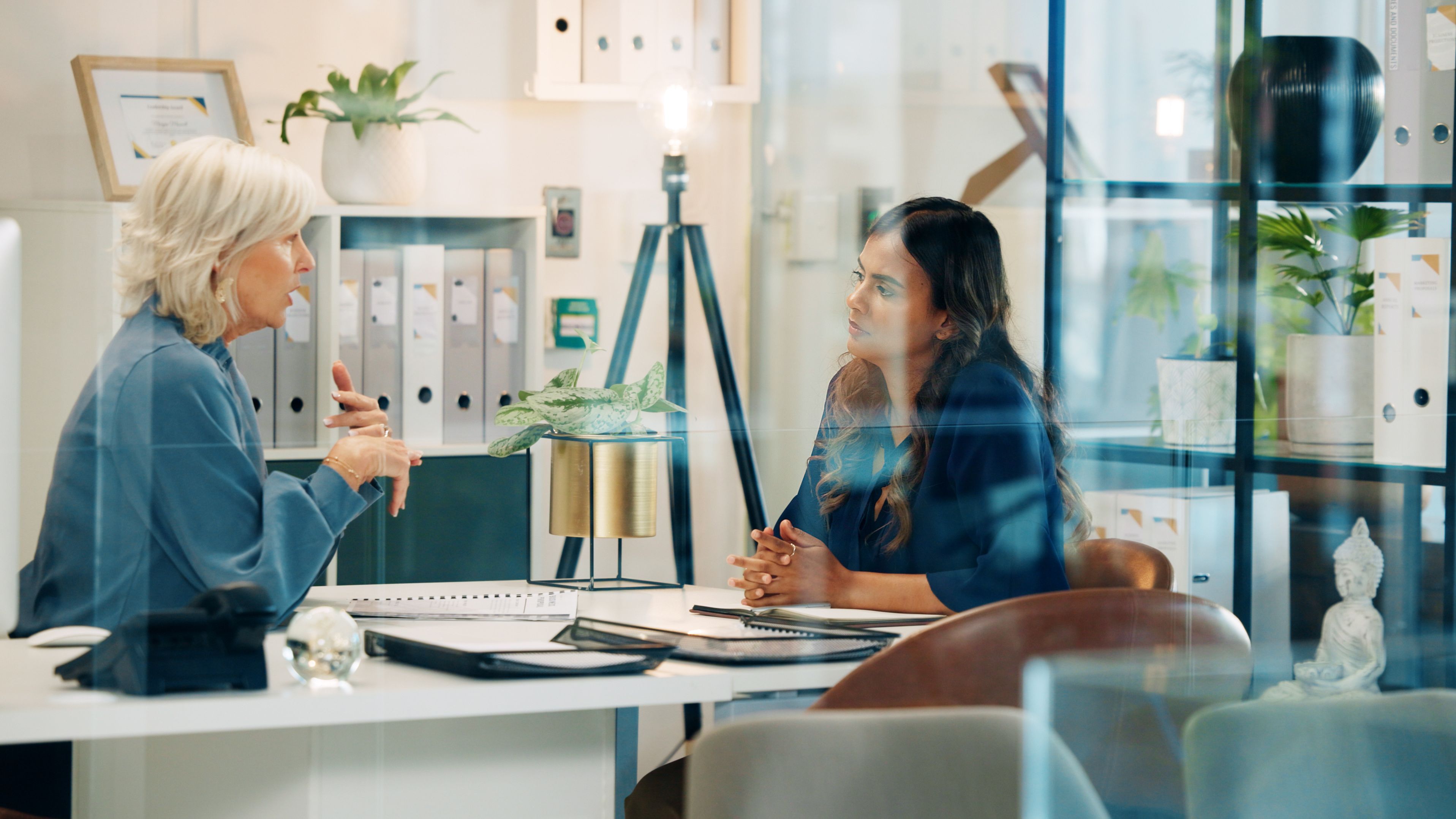 Picture: Two women talking in the office