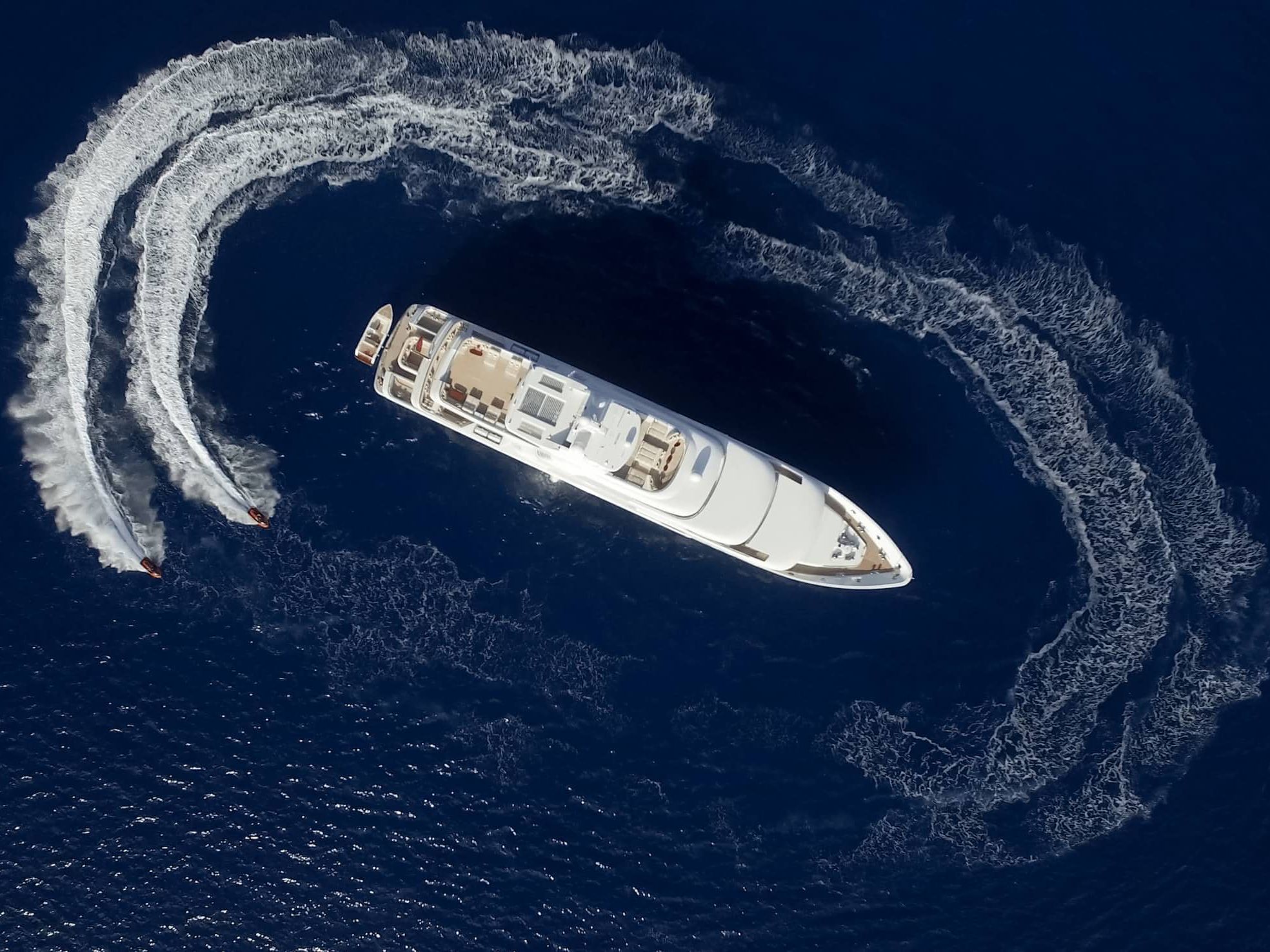 High angle ship with two small boats