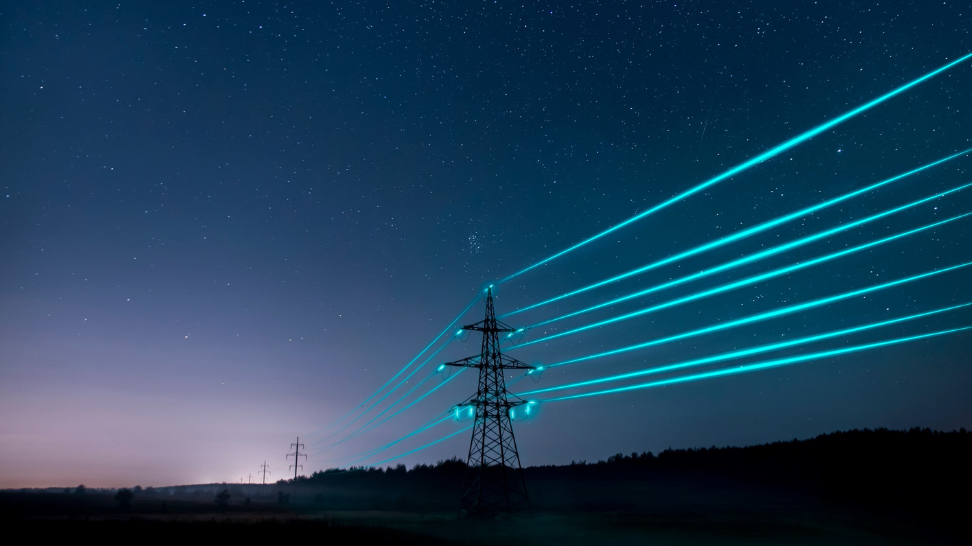 Image: an electricity pylon in a nocturnal landscape with glowing blue energy lines