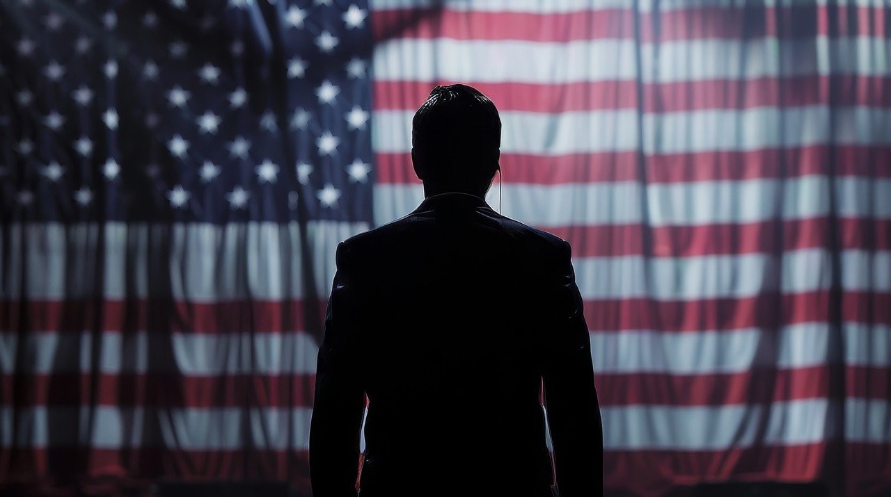 Person is looking at the US flag.